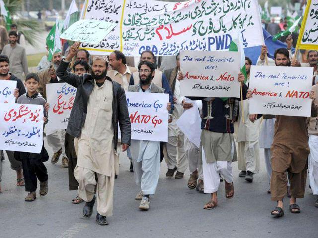 Pakistani protesters march on a street during a demonstration in Islamabad against the cross-border Nato air strike on Pakistani troops. Several hundred journalists, labour leaders and traders took to streets to condemn a recent air strike by Nato on Pakistani military checkposts that killed 24 soldiers. AFP Photo/Aamir Qureshi