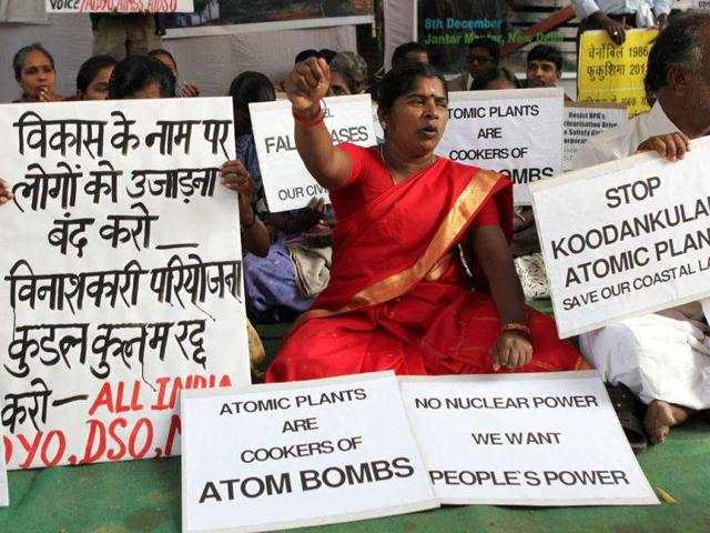 Activists hold placards during an anti-nuclear protest at Jantar Mantar in New Delhi. Various organisations held a protest to demand the scrapping of nuclear projects which are endangering the safety and livelihood of people. HT Photo by Vipin Kumar