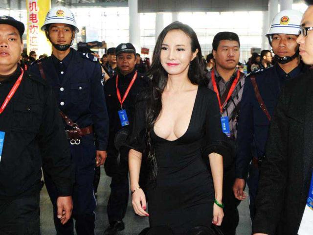 Gan Lulu, in a revealing outfit, attends the ASEAN International Auto Show in Nanning, south China's Guanxi Province. China out AFP Photo