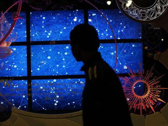 A teen walks by a Macy's holiday window display in New York City. Most of New York City's major department stores construct elaborate holiday window displays that become a destination for tourists and locals alike. (AFP Photo)
