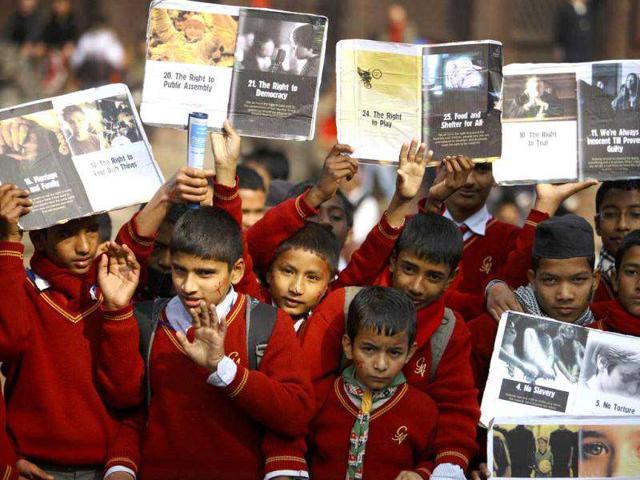 Children pose for a photo as they participate in a rally marking International Human Rights Day in Kathmandu. Reuters/Navesh Chitrakar