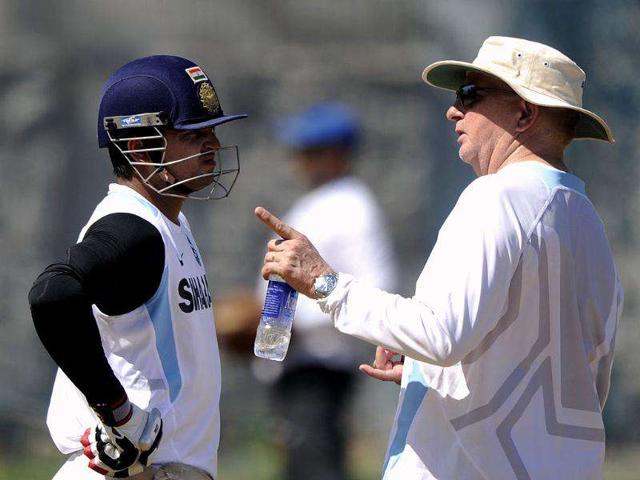 Duncan Fletcher (R) talks with Suresh Raina during a training session ahead of the final ODI match between India and West Indies at The MA Chidambaram Stadium in Chennai. AFP Photo/Dibyangshu Sarkar