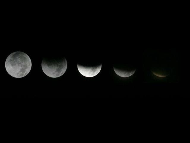 In this photo combination, the different stages of the moon during a lunar eclipse as seen from the Griffith Observatory in Los Angeles. (AP Photo)
