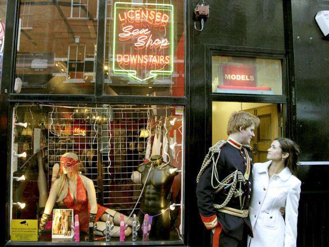 Lookalikes of Britain's Prince Harry and Pippa pose outside an adult shop during a media event in London. Stefan Wermuth/Reuter