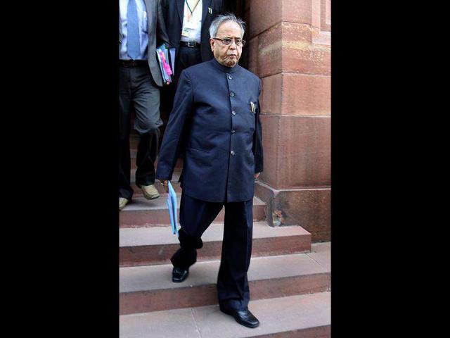 Finance minister, Pranab Mukherjee, arrives to attend the winter session at Parliament House in New Delhi. (HT Photo/Sonu Mehta)