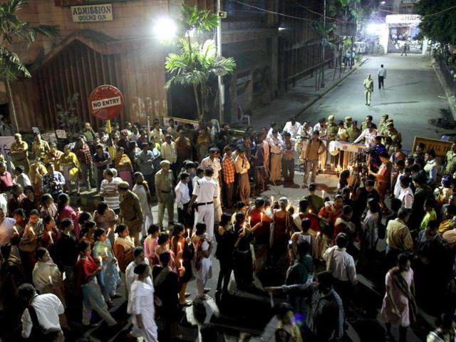 People take out a candle light vigil near the AMRI Hospital in memory of those who died in AMRI tragedy, in Kolkata.