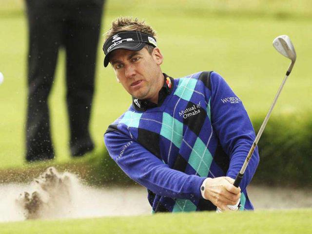 Ian Poulter of Britain plays out of a greenside bunker during the pro-am round before the Australian Masters, at the Victoria Golf Club in Melbourne. (Reuters/Brandon Malone)