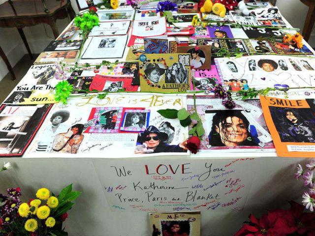 A tribute from fans to Michael Jackson fills the space where the bed on which the late pop star passed away on in a re-creation of the Medicine Room. (AFP PHOTO / Frederic J. Brown)