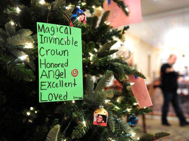 Decorations from fans hang on a Christmas Tree during the auction.(AFP PHOTO / Frederic J. Brown)
