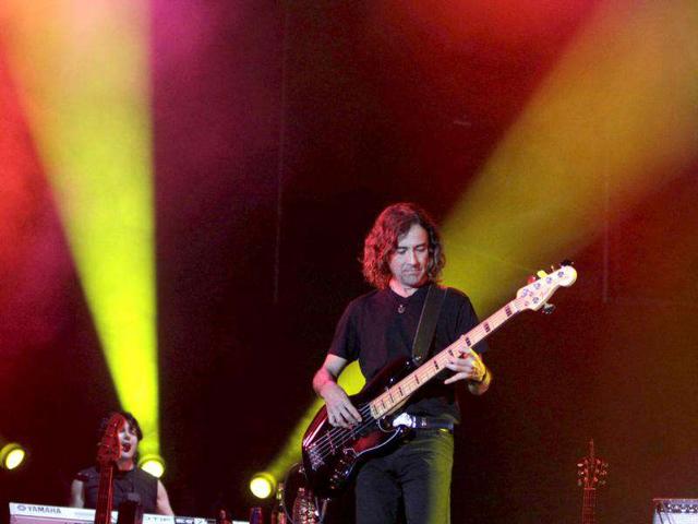 Mexican rock group Mana guitarist Juan Calleros performs during a concert on their Latin America tour at the Jockey Club in Asuncion.