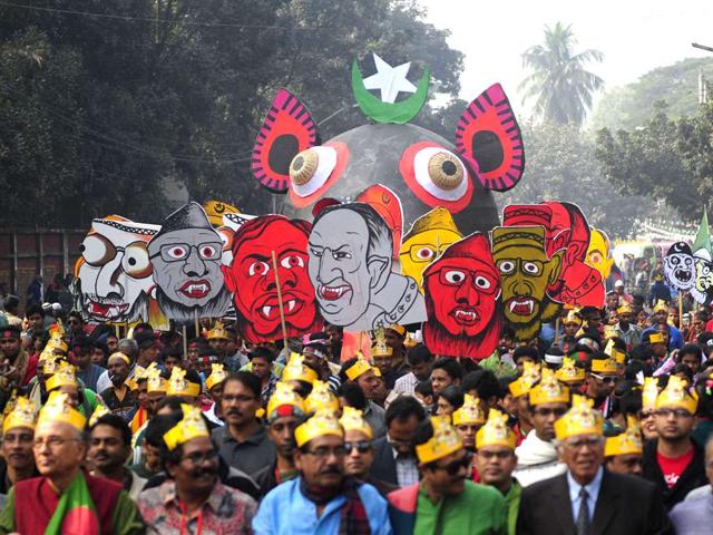 Bangladeshis carry caricatures of war criminals during a rally held to mark the country's 40th Victory Day in Dhaka. Bangladesh won independence from Pakistan after a bitter nine-month war in 1971.