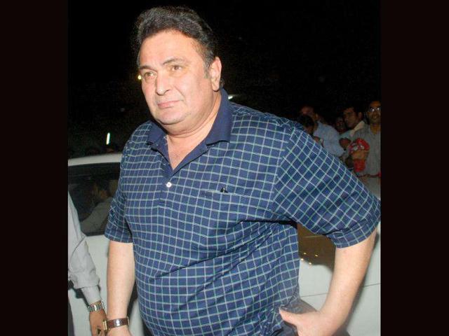 Actor Rishi Kapoor arrives to pay tribute to actor Dev Anand during a condolence meeting in Mumbai on Friday. (UNI)