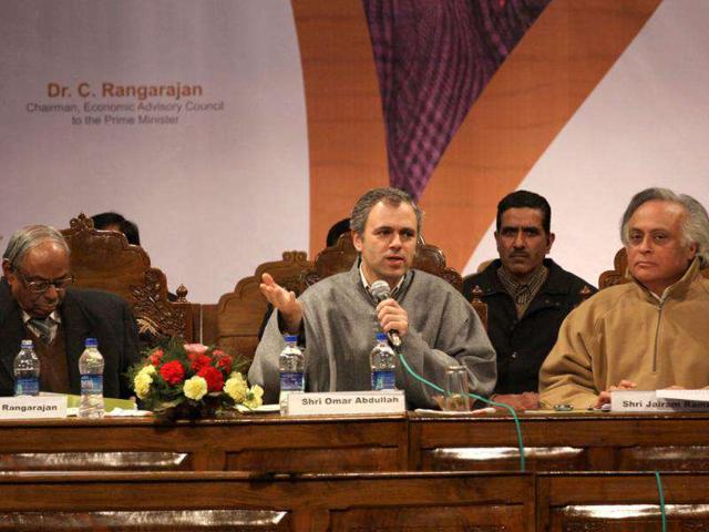 Omar Abdullah with Jairam Ramesh and C Rangarajan, chairman, economic advisory council to Prime Minister during a function held in connection with the distribution of appointment letters under Himayat project launched to provide skill development training to the unemployed youth of Jammu and Kashmir in Srinagar. HT Photo/Waseem Andrabi