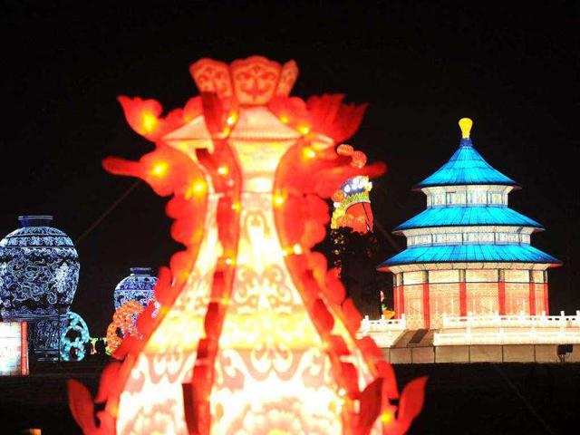 Visitors admire the giant lanterns on display at the International Lantern Festival in Hefei, east China's Anhui province. The International Lantern Festival showcases thousands of lanterns to attract tourists ahead of the Spring Festival or better known as the Chinese New Year on January 22, 2012.