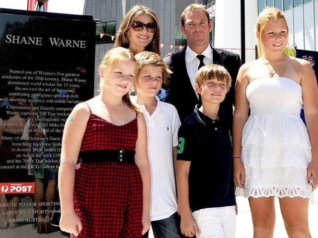 Australian cricket player Shane Warne (R rear) and fiancee Liz Hurley (L rear) stand with Warne's children Summer (L), Jackson (2/L), Brooke (R) and Hurley's son Damien (2/R) at the unveiling of his statue outside the Melbourne Cricket Ground, in Melbourne.