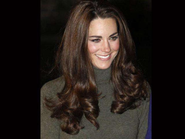 Kate poses for a smile as she arrives at the venue. (AP Photo)