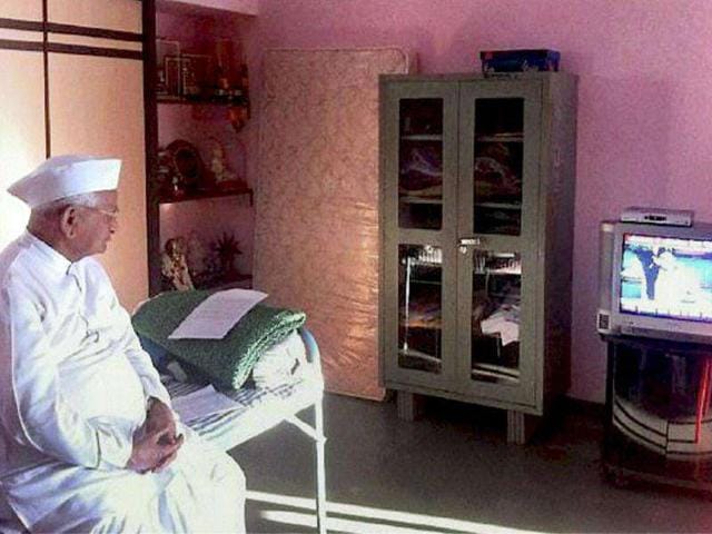 Anti-corruption activist Anna Hazare watches Parliament proceedings regarding Lokpal Bill on a TV, in his native village Ralegan Siddhi in Ahmednagar. Anti-corruption activist Anna Hazare watches Parliament proceedings regarding Lokpal Bill on a TV, in his native village Ralegan Siddhi in Ahmednagar.