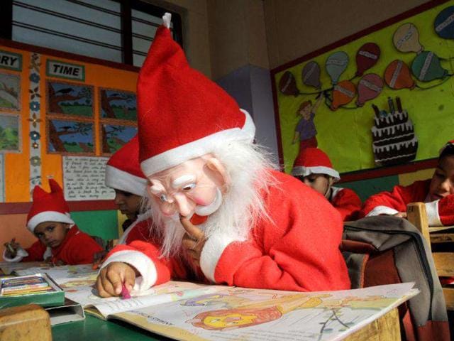 Children dress up as Santa Claus during Christmas celebration at a school in Gurgaon. HT Photo by Parveen Kumar