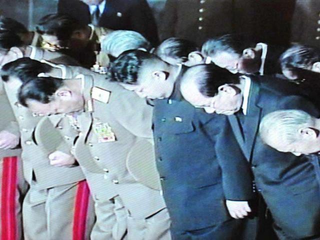 This December 23, 2011 screen capture of the North Korean TV footage shows Kim Jong-Un (C) with senior officials pays condolence near the body of Kim Jong Il lying in state in a glass coffin. AFP photo