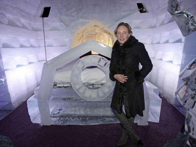 Dutch hotel manager, Annet van Limburg, stands inside one of the rooms at the first Dutch ice hotel in Zwolle. The room temperature hovers around eight degrees Celsius. Built for an ice sculpturers' festival in Zwolle and managed by a local hotel, the structure has three rooms and stands within a refrigerated warehouse. AFP Photo / Anoek De Groot