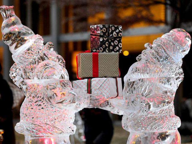 People look at ice statues of Nisse, a model of Norwegian Santa Claus, at a hotel in Tokyo. Ice carving championship medalist Yoshihito Kosaka sculptured the ice statues as a main feature to attract visitors at the hotel on Chiristmas Eve.
