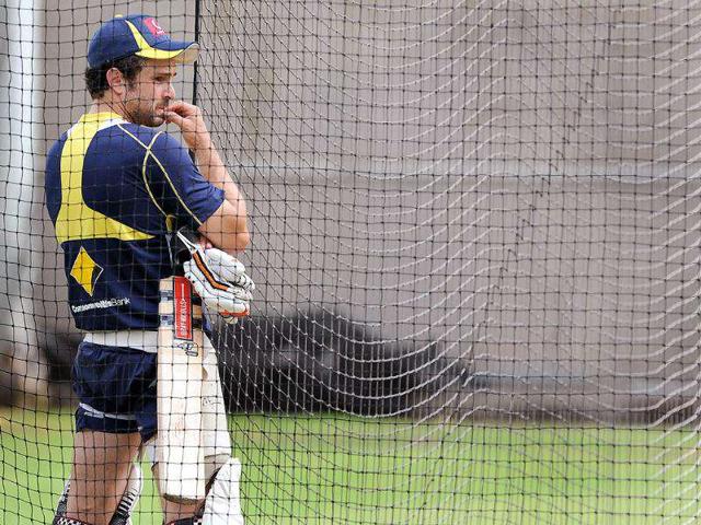 Australian batsman Ed Cowan looks on as he prepares to bat while training for their upcoming Test match against India at the Melbourne Cricket Ground. AFP Photo/William West