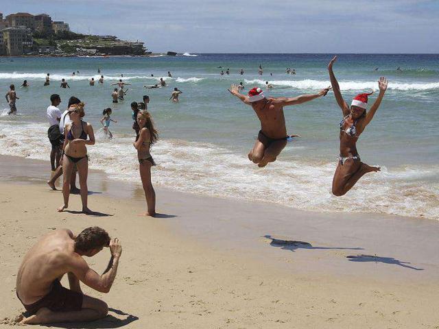 Beach goers jump in the air for a photo as they celebrate on Christmas Day at Bondi Beach in Sydney, Australia. AP Photo