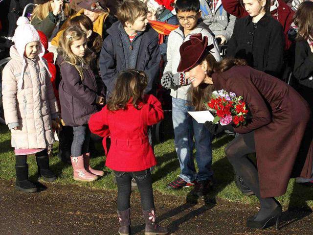 Britain's Catherine, Duchess of Cambridge greets well-wishers after leaving a Christmas Day service at St Mary Magdalene Church on the Royal estate at Sandringham, Norfolk in east England. Reuters/Suzanne Plunkett.