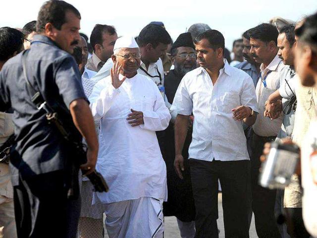 Anna Hazare leaves after paying respects to Father of The Nation Mahatma Gandhi before embarking to MMRDA ground for a 3 day-long fast. AFP Photo