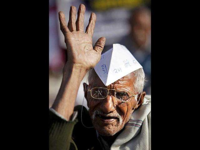 Raj Kumar, 80, a supporter of Anna Hazare shouts slogans against the government in Jammu. AP Photo