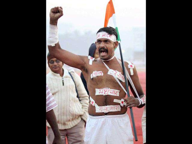 A supporter shouts slogans during the second day of Anna Hazare's protest for Jan Lokpal Bill at MMRDA Grounds in Mumbai. PTI Photo