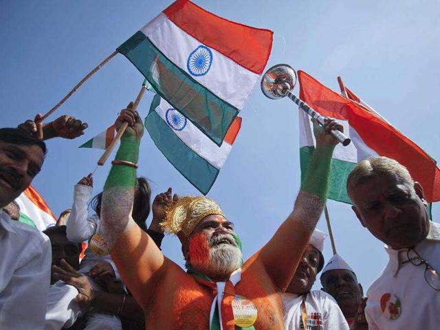 Supporters of Anna Hazare dance while waving national flags during his three-day fast at the Bandra-Kurla Complex grounds in Mumbai. Reuters Photo