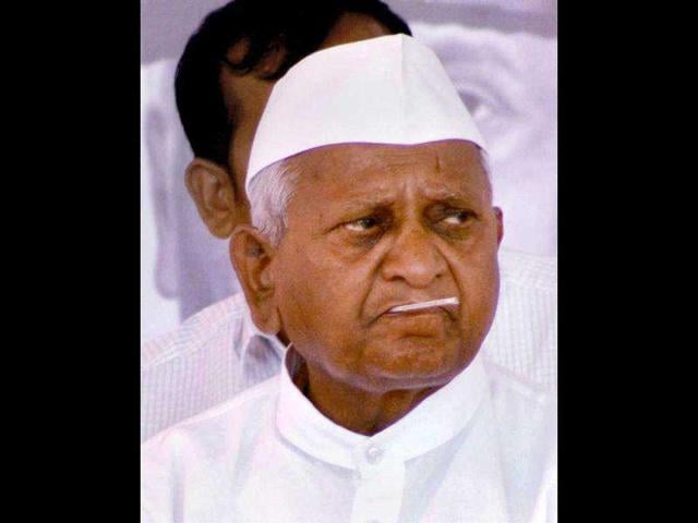 Hazare holds a thermometer in his mouth during his three-day fast in Mumbai. PTI