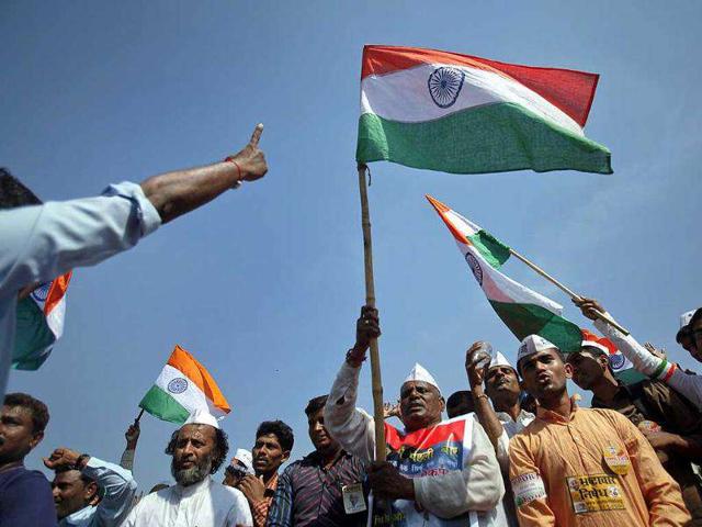 Supporters of Anna Hazare wave national flags during his three-day fast at the Bandra-Kurla Complex grounds in Mumbai. Reuters Photo