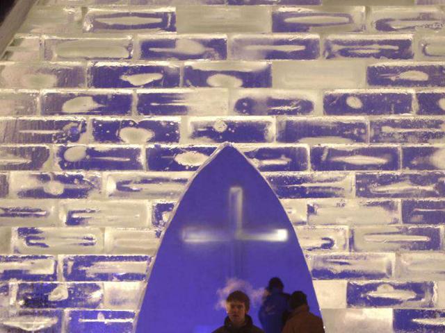 People look inside a Catholic church made of snow in the Bavarian village of Mitterfirmiansreut, near the German-Czech border.
