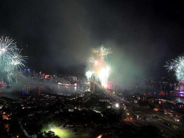 Fireworks burst over the Sydney Harbour Bridge, center, and the Opera House, right, during New Year's celebrations in Sydney. AP Photo