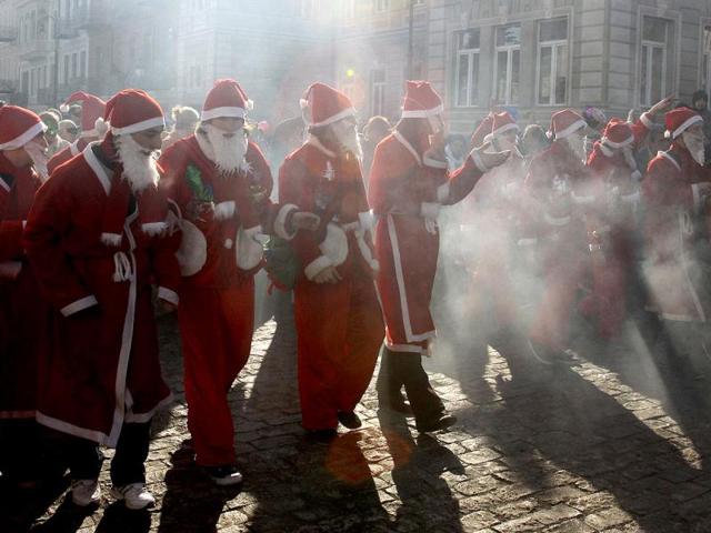 People dressed as Santa Clause parade in downtown Tbilisi, Georgia. AP Photo