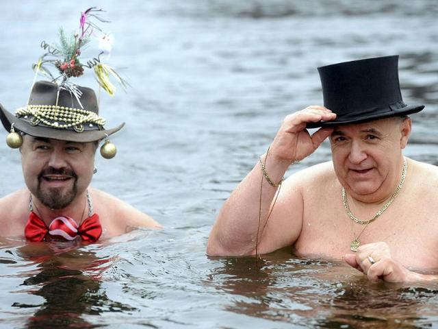 Winter bathers of the "Berlin Seals" pose in the four degrees Celsius cold water of the Orankesee lake during a new year's swimming event in Berlin. AFP Photo