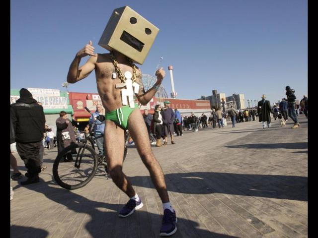 A reveler poses for a picture as he takes part in the Coney Island Polar Bear Club's annual New Year's Day Polar Bear Swim in New York's Coney Island. (Reuters/Kena Betancur)