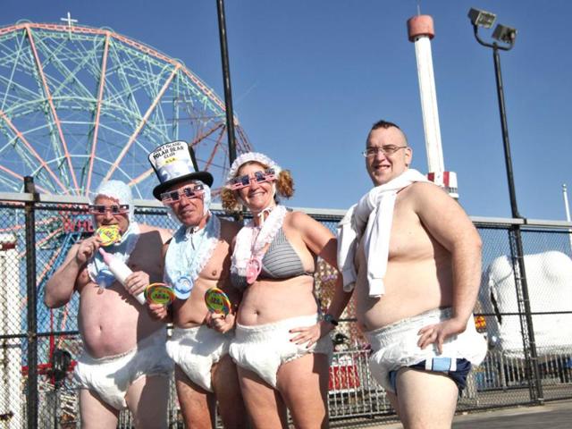 Revelers take part in the Coney Island Polar Bear Club's annual New Year's Day Polar Bear Swim in New York's Coney Island. (Reuters/Kena Betancur)