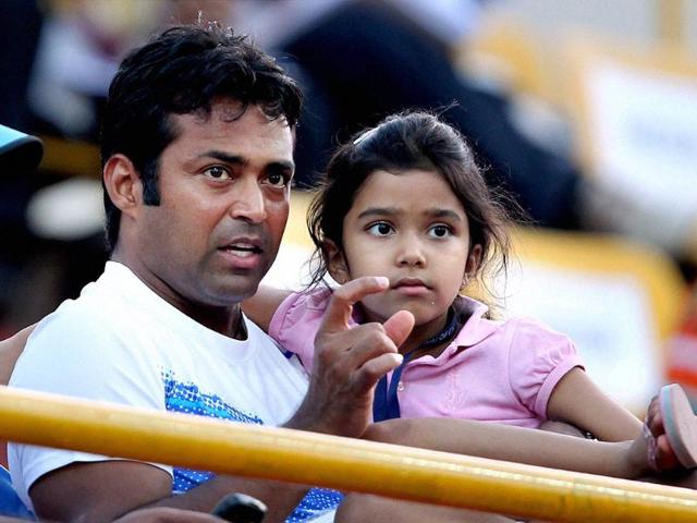Leander Paes along with his daughter watching the first round match between India's Yuki Bhambri and Slovakia's Karol Beck at the ATP Chennai Open 2012 in Chennai. PTI Photo