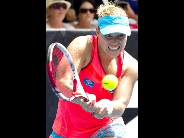 Angelique Kerber of Germany hits a return in her quarterfinal match against her compatriot Sabine Lisicki at the ASB Classic women's tennis tournament in Auckland, New Zealand.(AP Photo/SNPA, David Rowland)