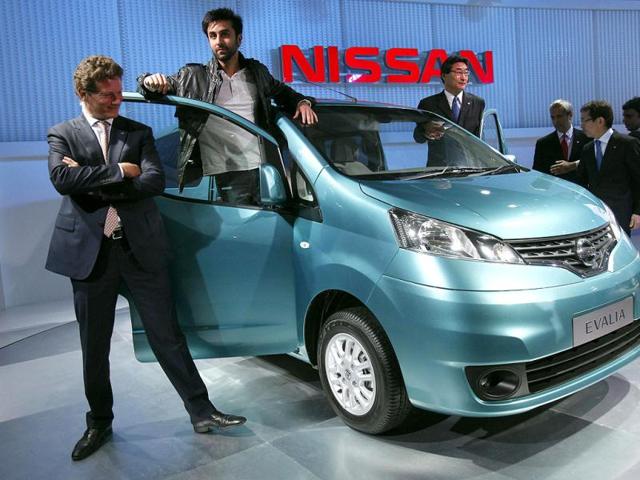 Ranbir Kapoor gestures during the unveiling of Nissan Motor Co's new Evalia car.