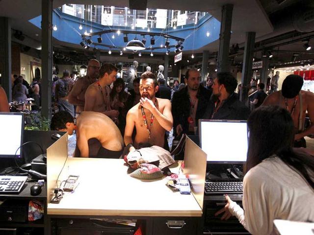 People in their underwear are seen in a clothing store in Seville. A clothing brand marked the start of sales by offering the first 100 customers free clothes, as long as they showed up in their underwear. Reuters/Marcelo del Pozo