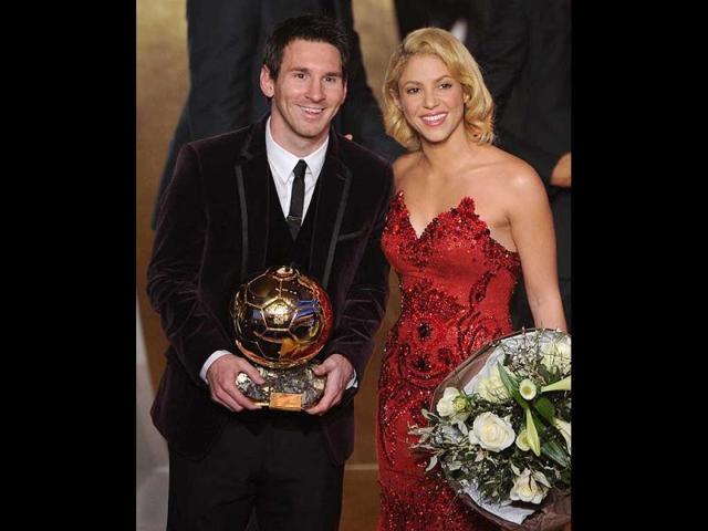Barcelona's Argentinian forward Lionel Messi poses with Colombian singer Shakira (R) after receiving for the third time the FIFA Ballon d'Or award at the Kongresshaus during the FIFA Ballon d'Or ceremony in Zurich. AFP PHOTO / FRANCK FIFE