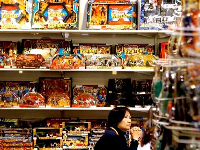 A vendor waits for customers at a stall during the Hong Kong toys and games fair. AFP Photo