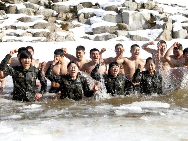 Members of the Special Warfare Command take a cold bath during an annual severe winter season drill during a photo opportunity for the media in Pyeongchang. Reuters