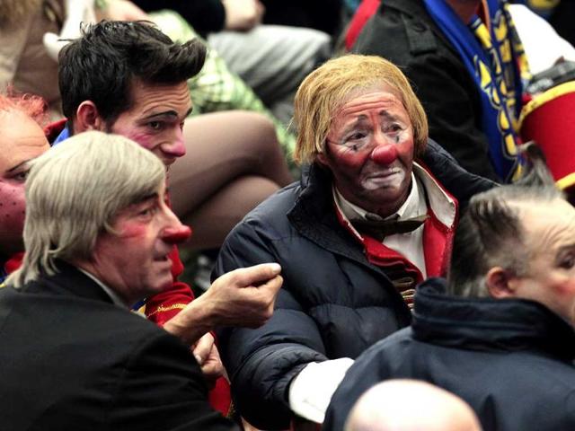 Clowns of an Italian circus wait for the start of Pope Benedict XVI's general audience in the Paul VI hall at the Vatican. AP Photo/Gregorio Borgia.