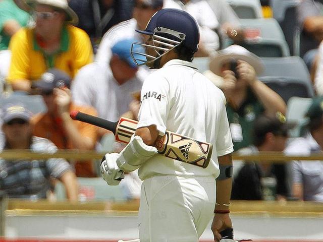 Sachin Tendulkar walks off the field after losing his wicket to Ryan Harris of Australia during their third Test cricket match at the WACA in Perth. Reuters