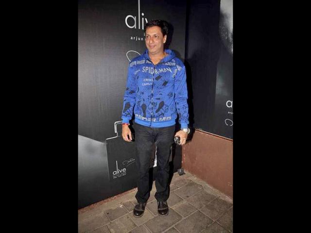 Madhur Bhandarkar looks happy.